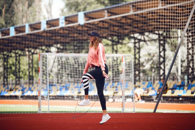 Free photo athletics girls in the stadium do exercises