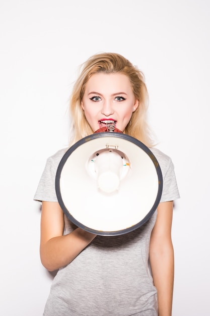 Free photo attractive blonde woman with megaphone stand in front of cameraman