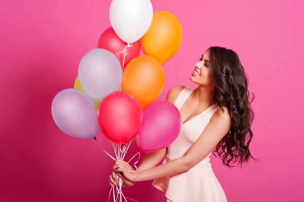 Attractive elegant woman with balloons