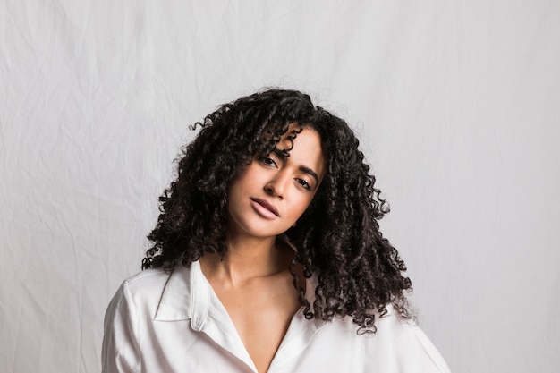 Attractive ethnic woman in white shirt 