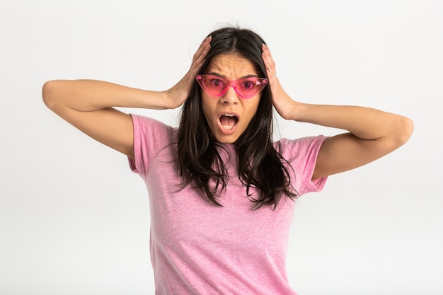 Attractive happy funny surprised emotional woman in pink t-shirt isolated arms forward surprised shocked expression of face