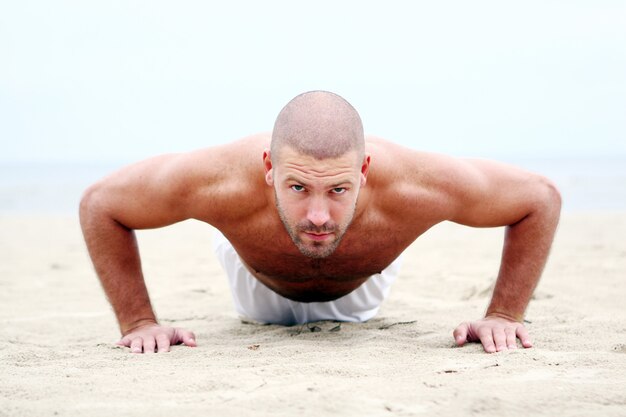 Attractive and happy man on beach