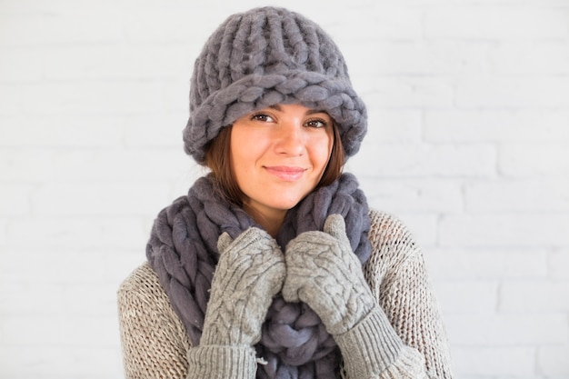 Attractive lady in mittens, hat and scarf