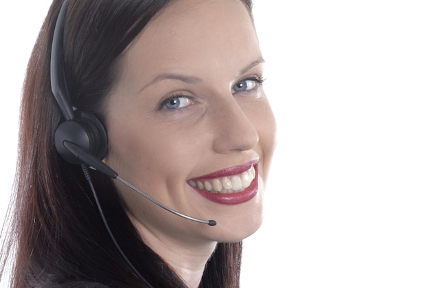 Free photo attractive lady using a telephone headset in a customer service role