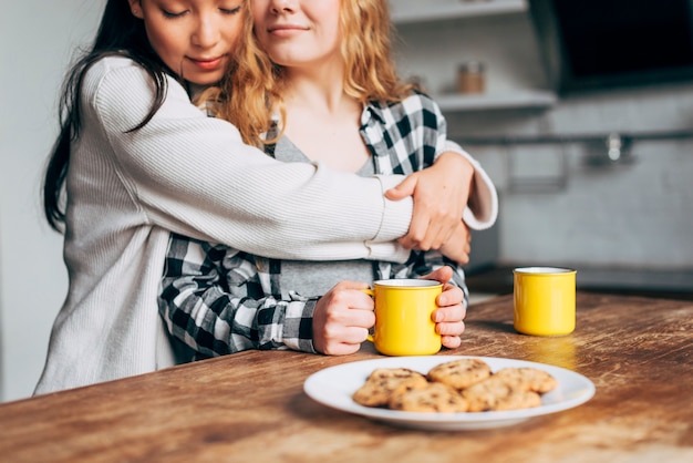 Attractive lesbian couple embracing