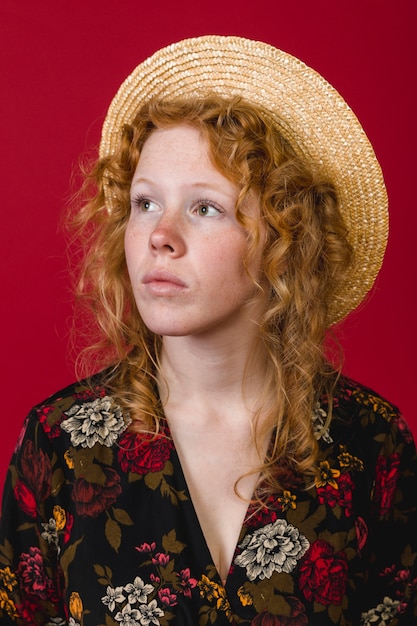 Attractive redhead young lady looking away