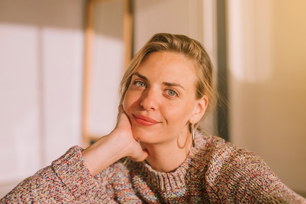 An attractive smiling young woman looking to camera