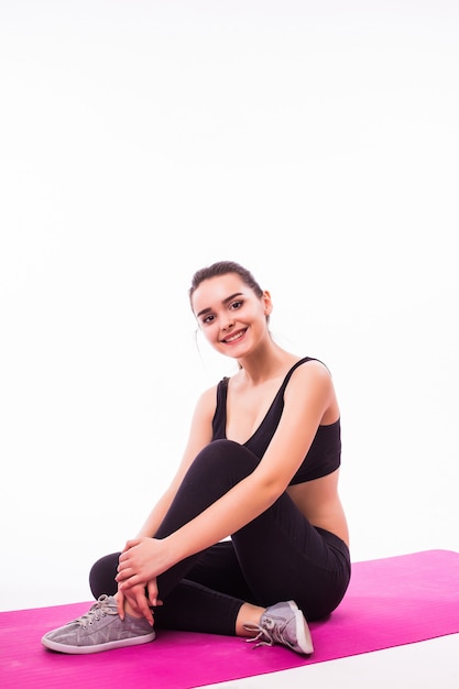 Attractive sporty woman exercising isolated on white background