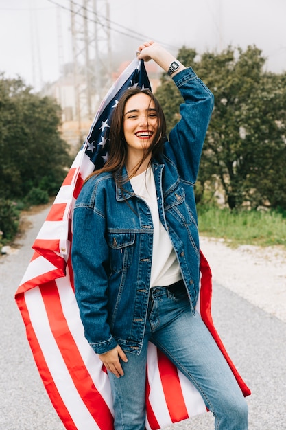 Free photo attractive woman smiling with flag