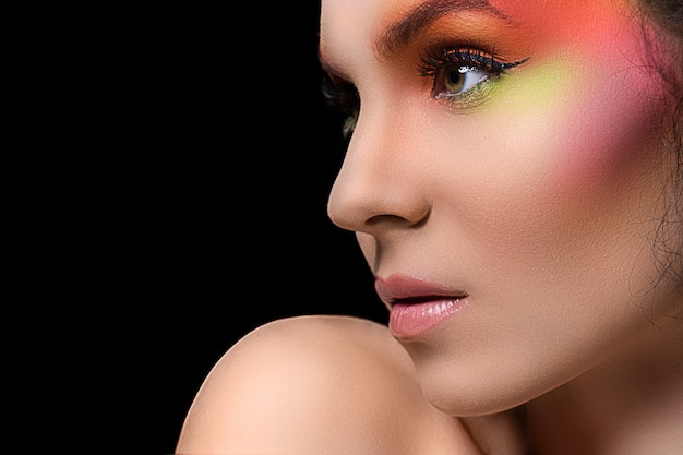 Attractive woman with colored make-up