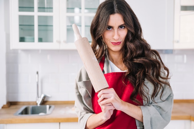 Free Photo attractive woman with rolling pin