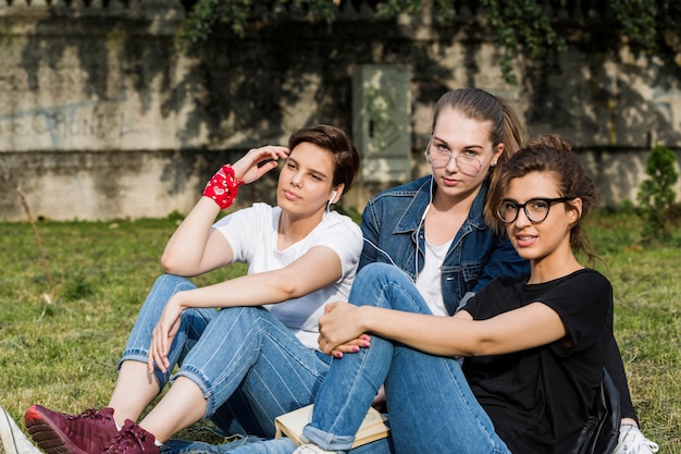 Attractive young friends spending time in park