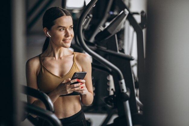 Attractive young woman exercising at the gym