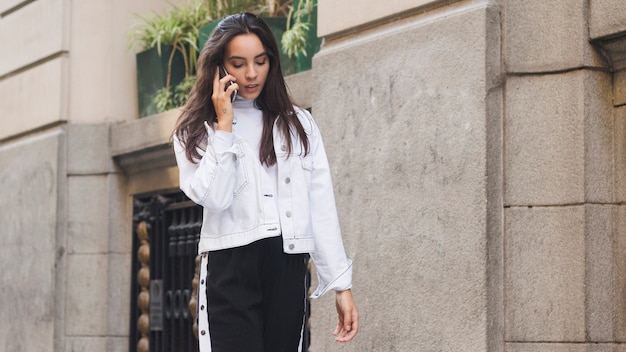 An attractive young woman talking on mobile phone