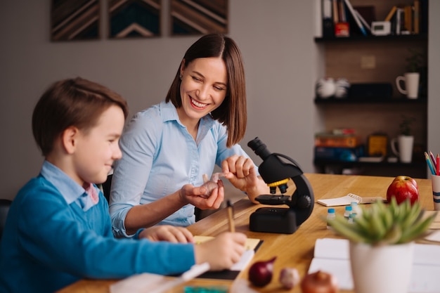 Aunt and nephew do homework together