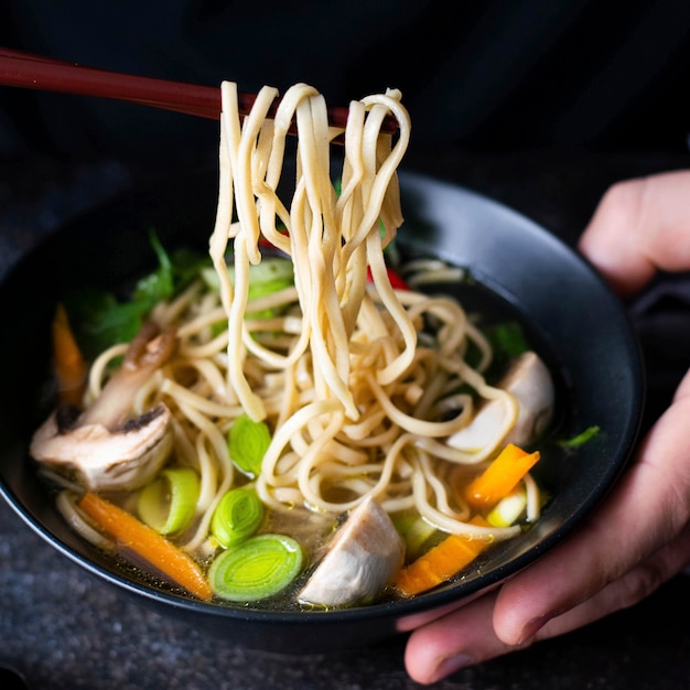 Free Photo authentic asian noodle soup in a black bowl