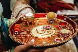 Free photo authentic indian tray with traditional sacred objects for wedding ceremony