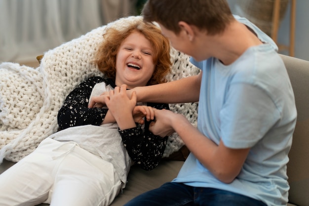 Free photo authentic scene of cousins hanging out together