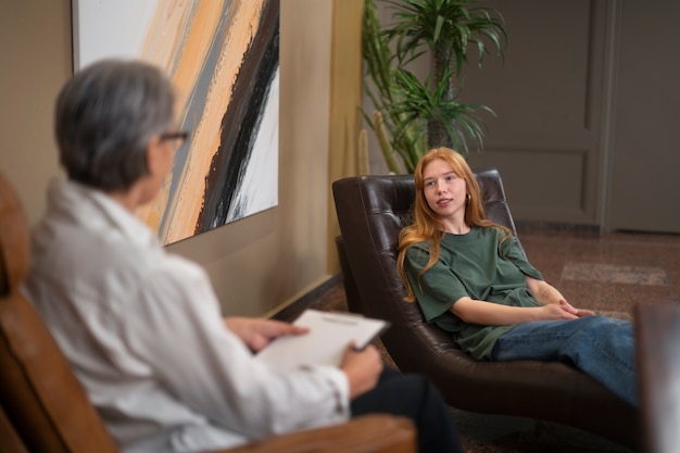 Free photo authentic scene of young person undergoing psychological therapy