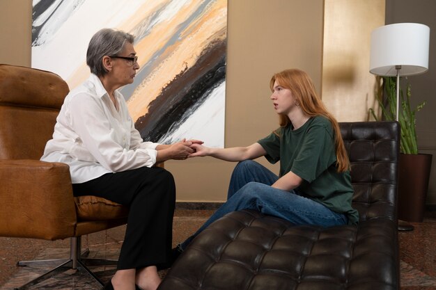 Authentic scene of young person undergoing psychological therapy