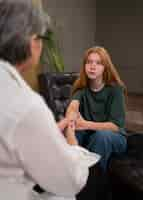 Free photo authentic scene of young person undergoing psychological therapy