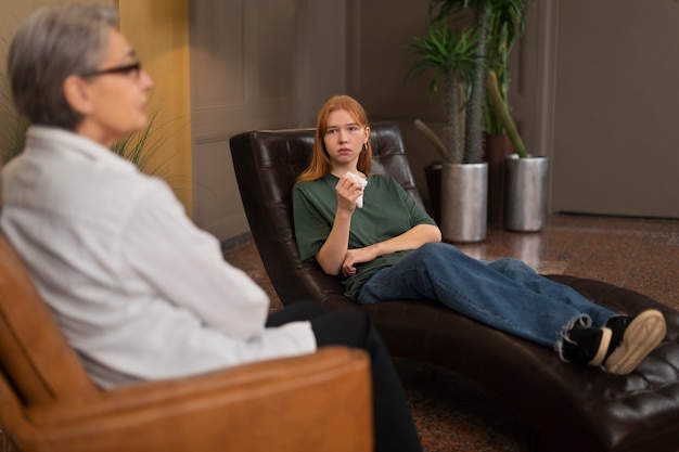 Free photo authentic scene of young person undergoing psychological therapy