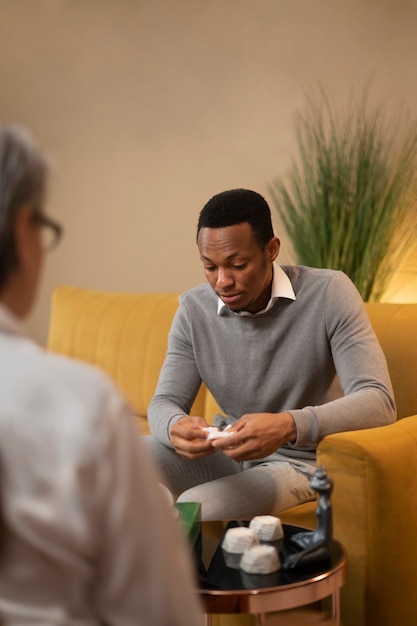 Authentic scene of young person undergoing psychological therapy