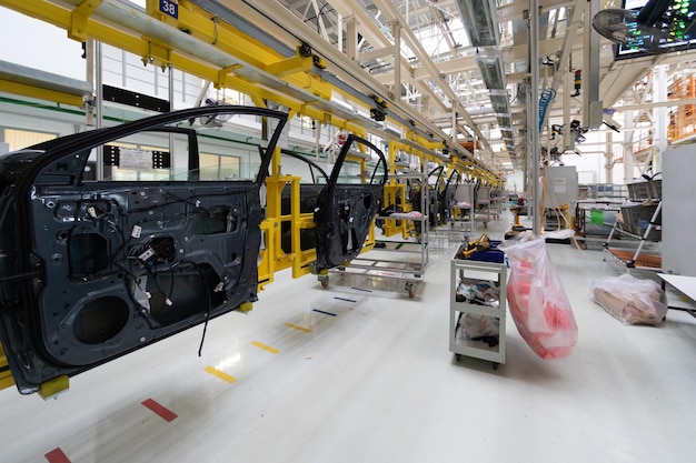 Free Photo automated car assembly line assembly of car door plant of automotive industry line of car body