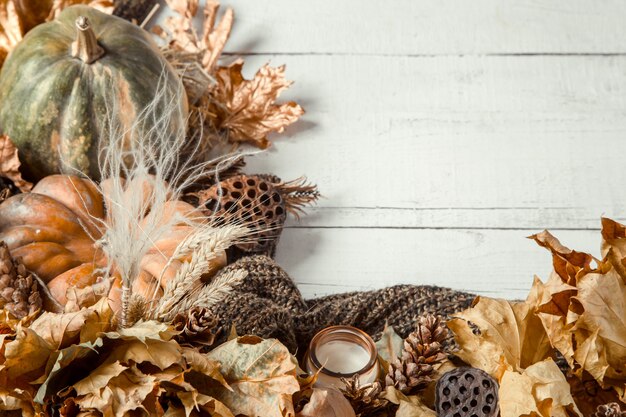 Autumn background with decorative items and pumpkin.