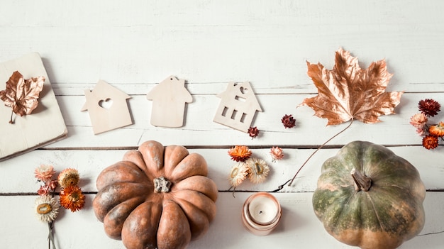 Free photo autumn background with different objects and pumpkin. flat-lay.