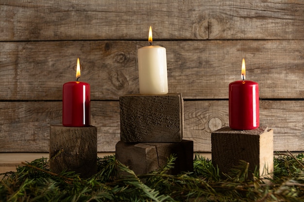 Autumn candles on wooden cubes