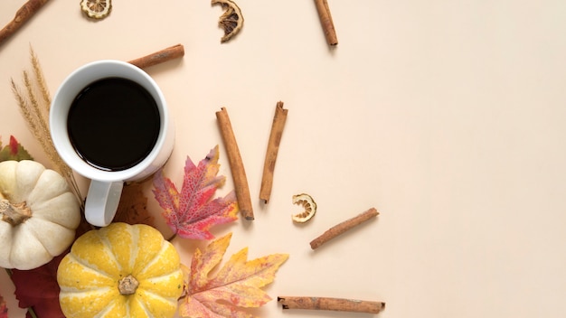 Autumn composition with coffee and cinnamon