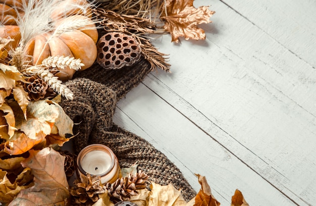 Autumn composition with decorative items and pumpkins