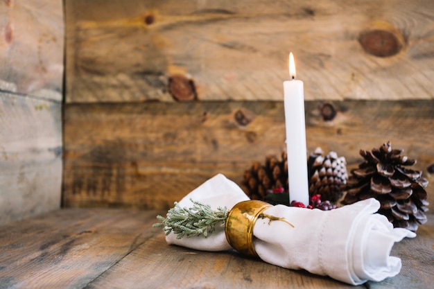 Autumn decoration with candle and herbs