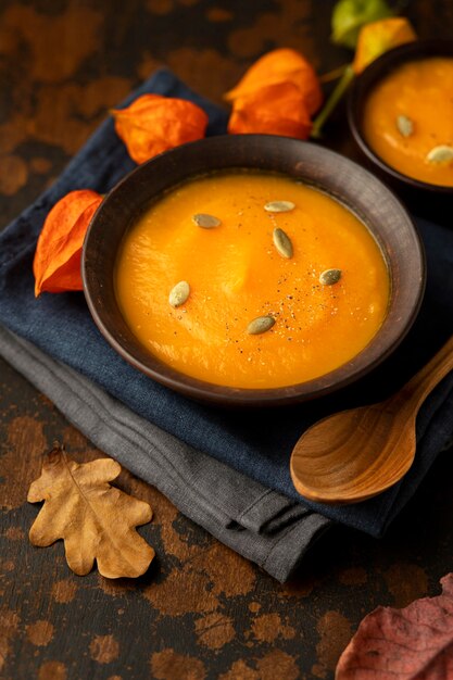 Free Photo autumn food pumpkin and mushroom soup high view