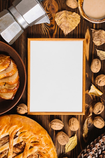 Autumn leaves and food around frame