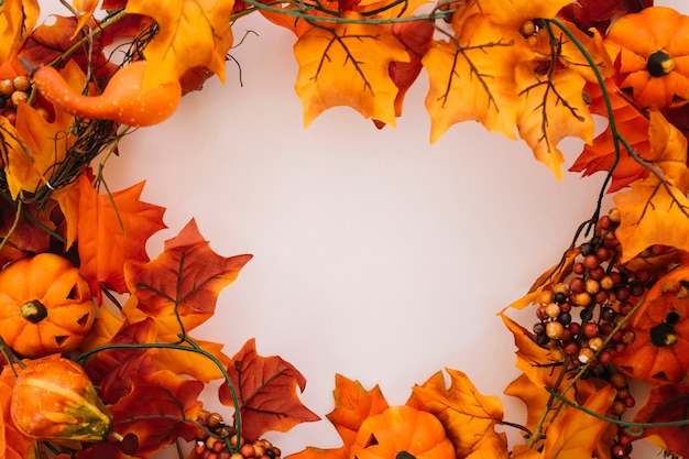 Free Photo autumn leaves with circular space