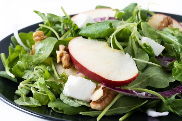 Free photo autumn salad with apples and walnuts isolated on white background