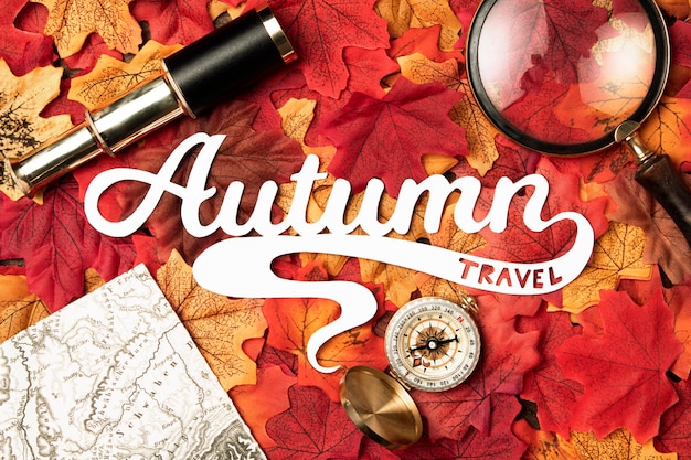 Free Photo autumn travel lettering with leaves