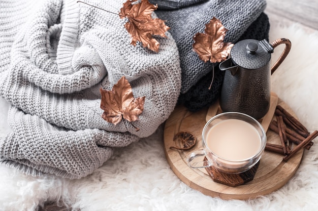 Autumn-winter Cozy home still Life with a Cup of hot drink.