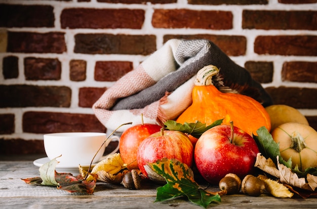 Free Photo autumnal arrangement with vegetables and plaid