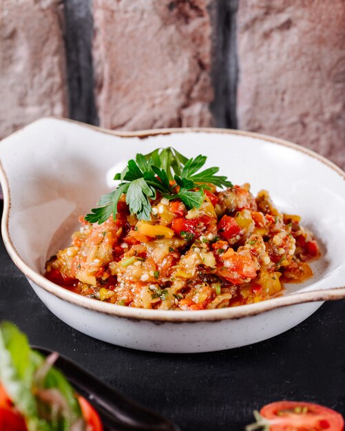 Free Photo azerbaijani mangal salad with parsley leaves in white plate.