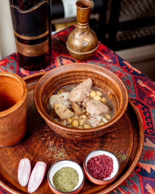 Free Photo azerbaijani traditional food piti and bottle of wine