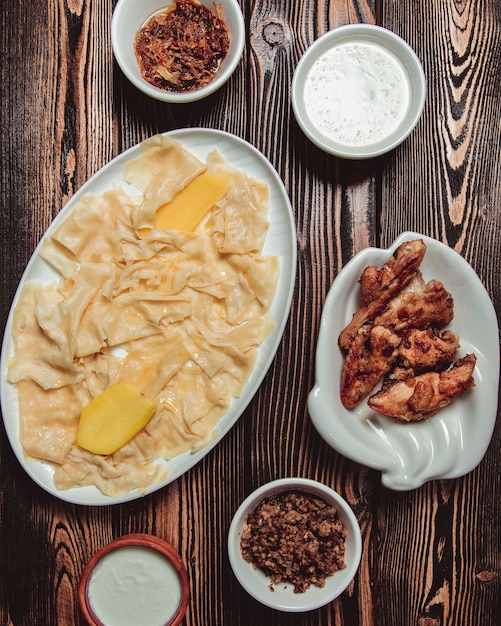 Azeri traditional khinkali in the form of leaves with fried onions, minced meat and gatyg