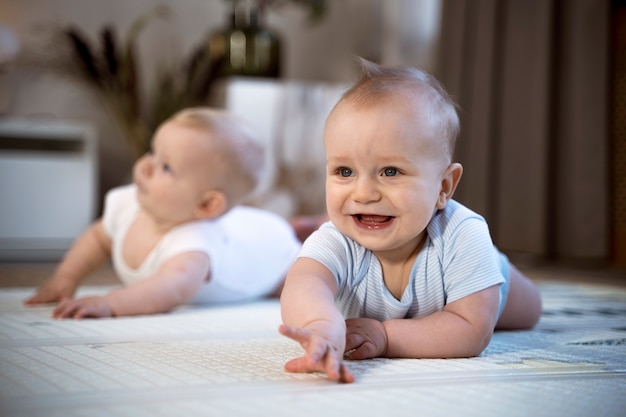 Babies crawling and learning to walk together