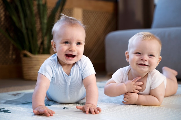 Babies crawling and learning to walk together