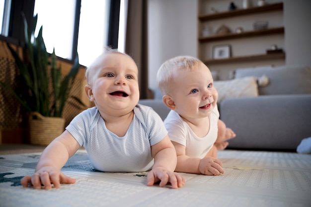 Babies crawling and learning to walk together