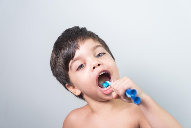 Baby boy brushing his teeth