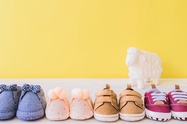 Free photo baby concept with four different pairs of shoes