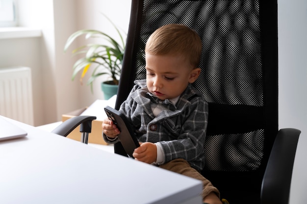 Free photo baby dressed up as business person